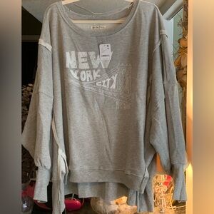 Free People Camden, New York City, size L.
NWT, Gray w/ white lettering.